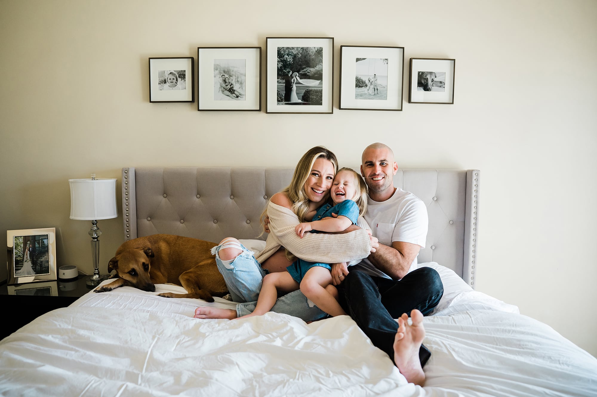 San Diego maternity photography family on bed with dog