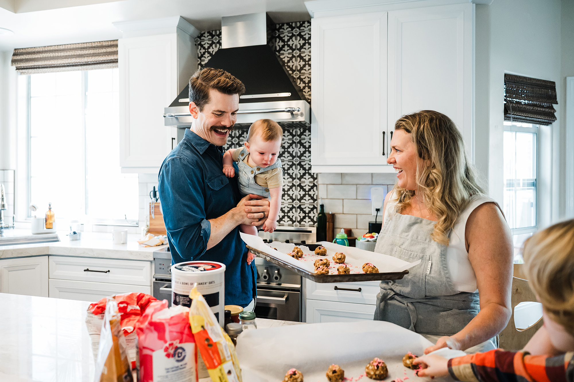 Family baking cookies during their San Diego at home family session