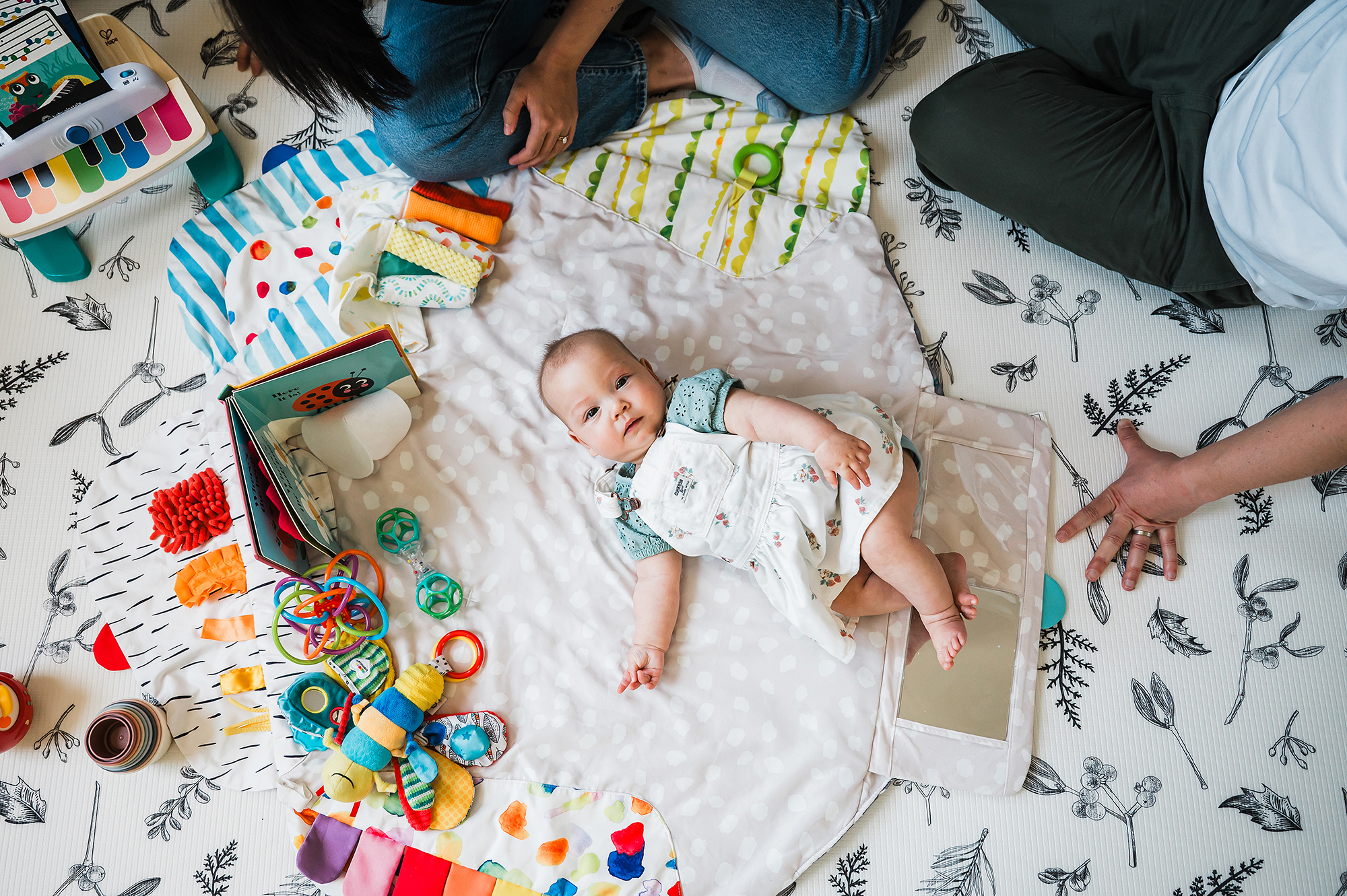 Six month old baby playing on the floor at home in San Diego